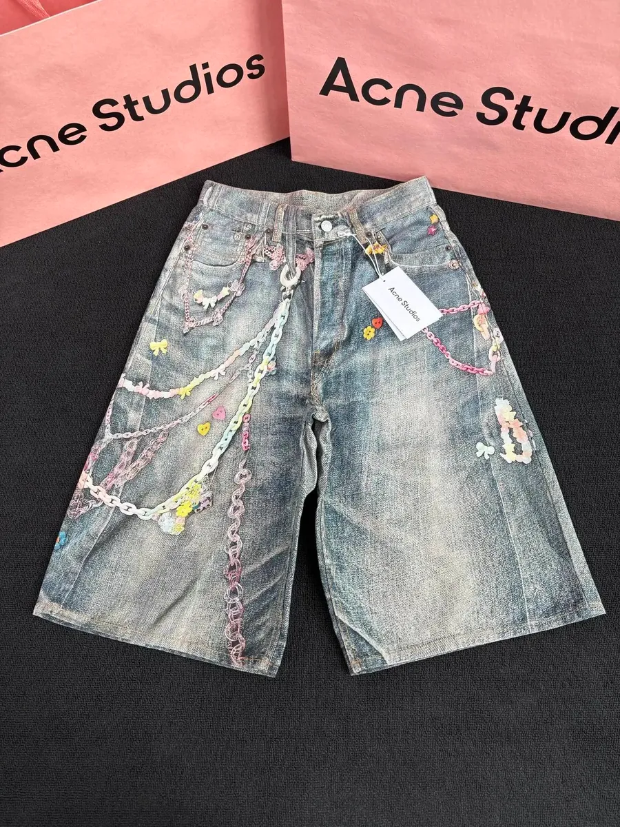 Acne Studios Denim Shorts with Embellished Chains and Floral Details